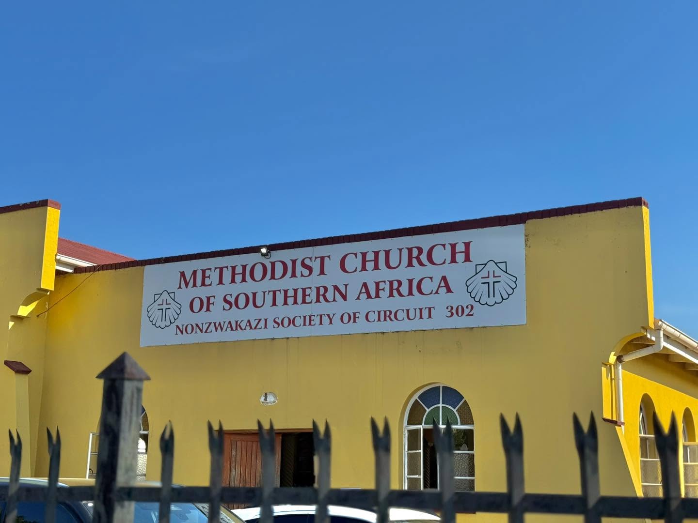 The Nonzwakazi society church in Mlungisi — a yellow building with arched windows and a sign reading Methodist Church of Southern Africa, Nonzwakazi Society of Circuit 302